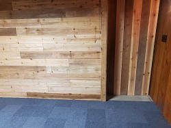 Handmade rolling farm door and built wall to add another bedroom in basement