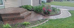 Complete grind out of brick stoop. Removed and reset paver walkway