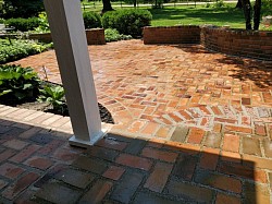 Removed and reset 90% of the brick on patio.