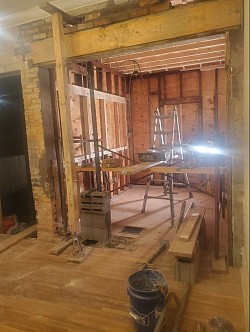 Turned the window into a doorway. Removed the load bearing masonry wall and set LVL BEAM to hold the load
